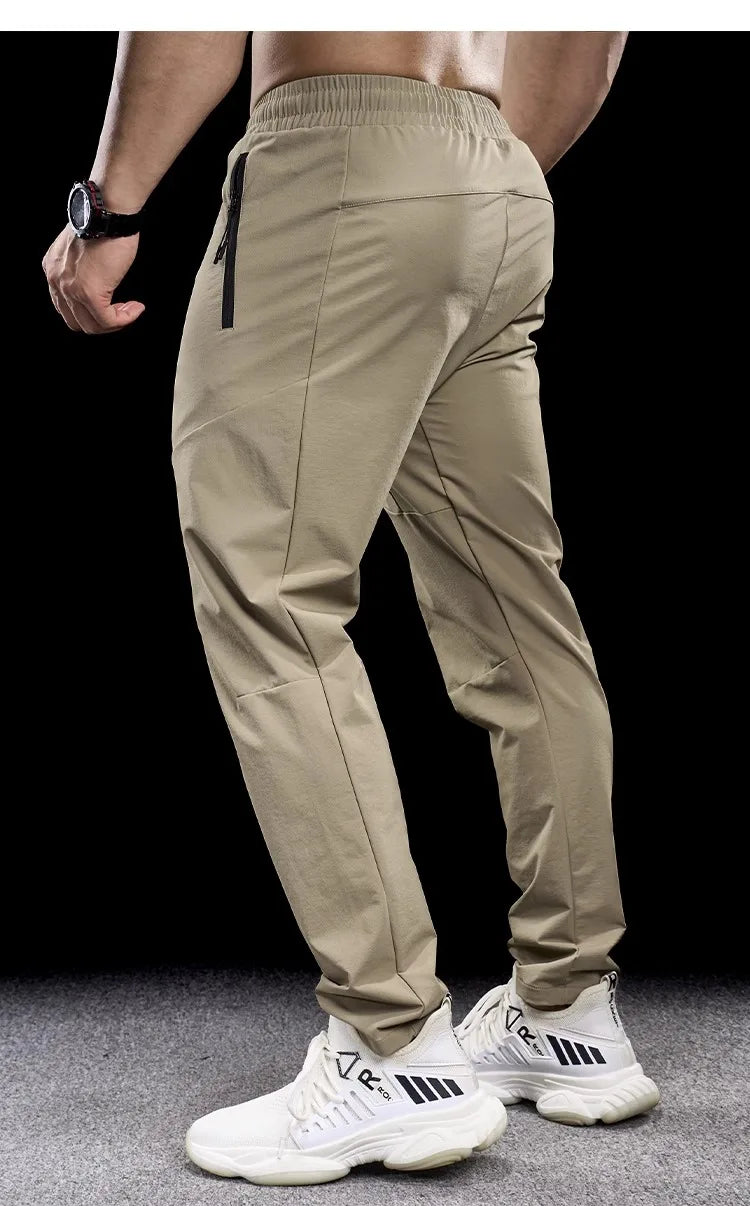 New Autumn Winter Men Quick-drying Sports Casual Trousers Gym Fitness Running Training Clothes Micro-elastic Zipper Pocket Pants 7 Sister Stars LLC